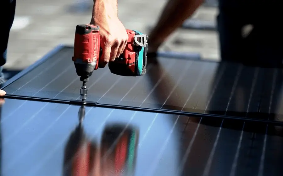 AllSolar Energy technicians working on a rooftop solar installation.